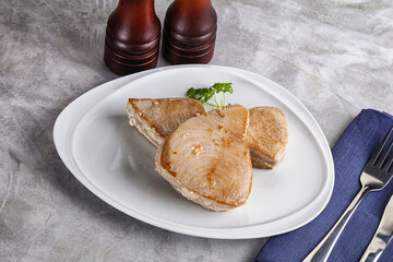 Roasted red tuna steak in the plate