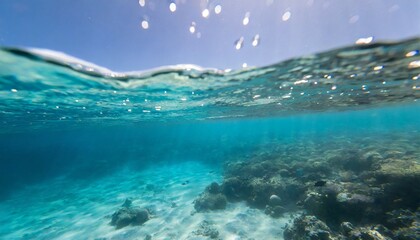 Fototapeta na wymiar underwater photo blue background panorama ocean surface and bottom of the sea