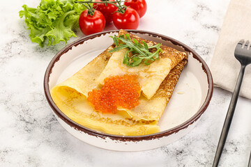 Russian pancake with red caviar