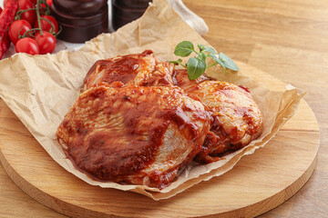 Marinated chicken leg in tomato sauce