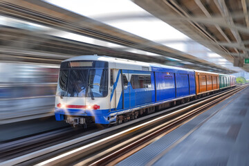 Modern high speed train overground metro with motion blur. - obrazy, fototapety, plakaty