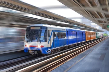 Foto op Plexiglas Modern high speed train overground metro with motion blur. © aapsky