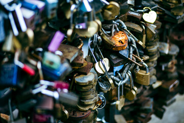 Obraz premium Many lockers tied together in a love bridge close up still in Riga, Latvia