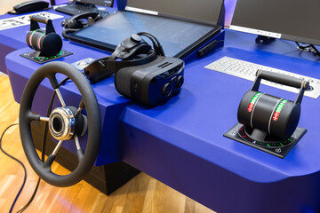 Marine simulation system, ship control panel with steering wheel and VR headset
