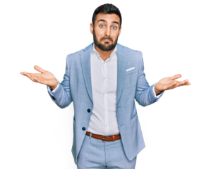 Young hispanic man wearing business jacket clueless and confused expression with arms and hands raised. doubt concept.