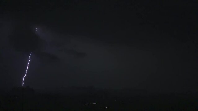Thunderstorm moving clouds at night with lightning 