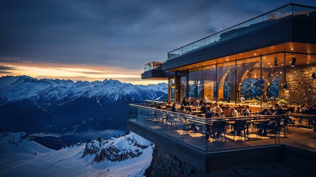 restaurant panoramique d'altitude en position dominante au sommet des montagnes enneigées