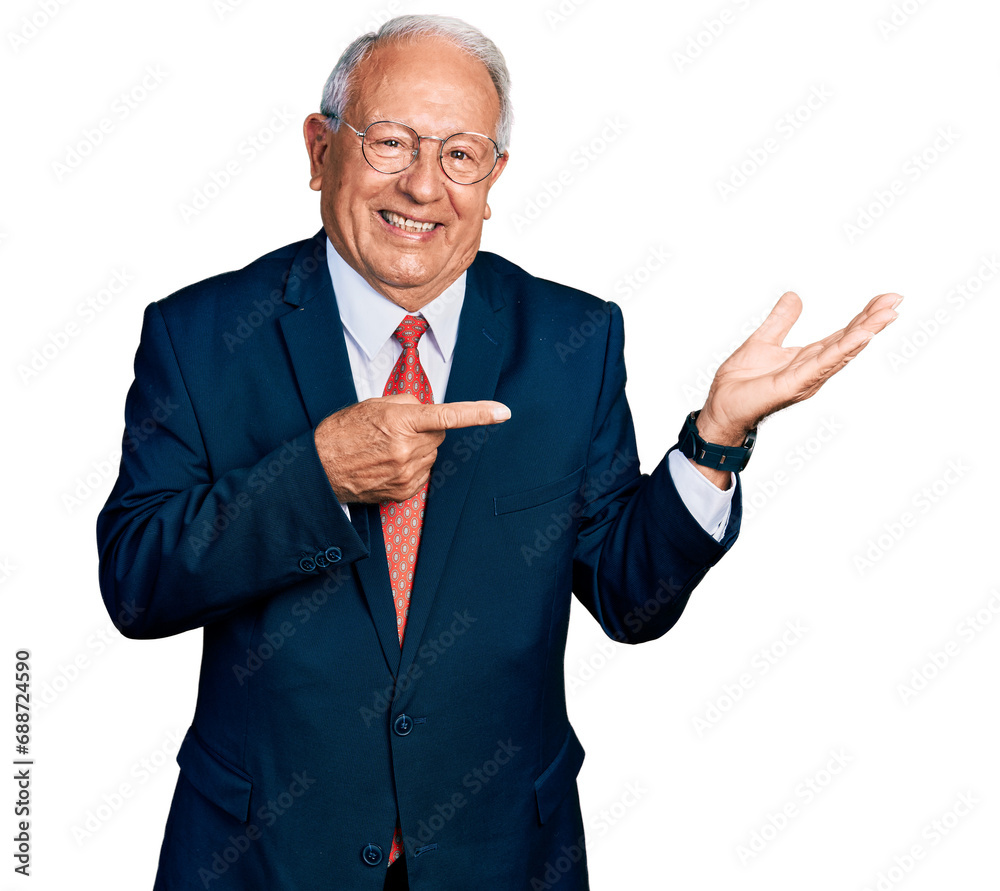 Sticker Senior man with grey hair wearing business suit and glasses amazed and smiling to the camera while presenting with hand and pointing with finger.