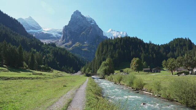 Swiss Alps view of Rosenlaui with Wellhorn and Reichenbach river in summer at Switzerland
