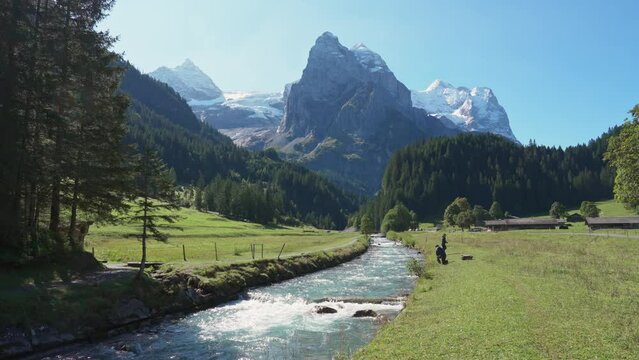 Swiss Alps view of Rosenlaui with Wellhorn and Reichenbach river in summer at Switzerland