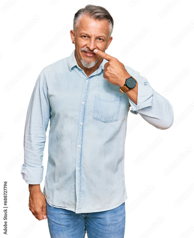 Sticker Middle age grey-haired man wearing casual clothes pointing with hand finger to face and nose, smiling cheerful. beauty concept