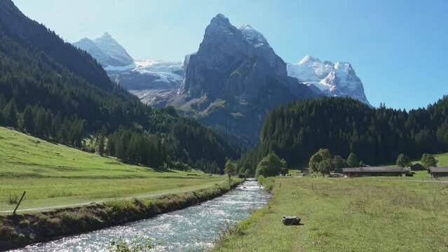 Swiss Alps view of Rosenlaui with Wellhorn and Reichenbach river in summer at Switzerland