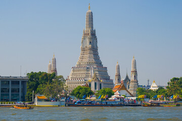 View of the main prang of the Buddhist temple Wat Arun (Temple of the Morning Dawn) on a sunny day. Bangkok