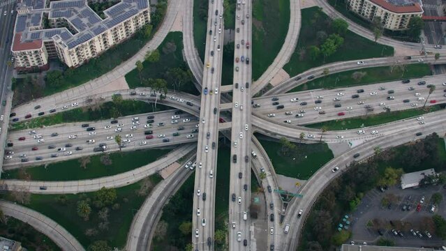 Aerial Overhead View of Famous Interchange in United States, Traffic in Interstate 110 and 10 Highway Full of Cars and Trucks Rush hour. Transportation.