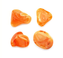 Four different carnelians of orange color - semiprecious gemstones, isolated on white background