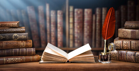 Old books ,quill pen and vintage inkwell in old library. Conceptual background on history,...