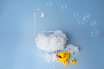 children's holiday decoration of the photo zone. small baby bath with foam and rubber duckies....