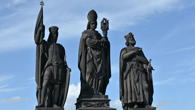 Prague, Czech Republic, August 4,2023.Sculptures on the Charles Bridge. The three figures of San Norbert, San Vaclav and San Sigismondo. Points of interest in the city. Beautiful summer day, tilt.