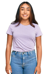 Obraz premium Young latin woman wearing casual clothes with a happy and cool smile on face. lucky person.