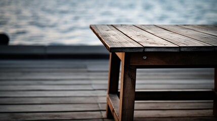 The table is made of wood and has a defocused image of a boat floating on a lake.