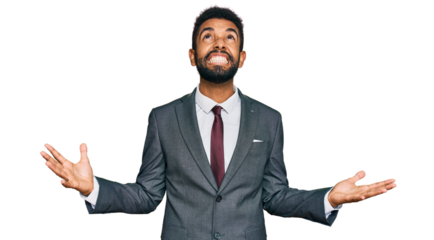 Young african american man wearing business clothes crazy and mad shouting and yelling with aggressive expression and arms raised. frustration concept.