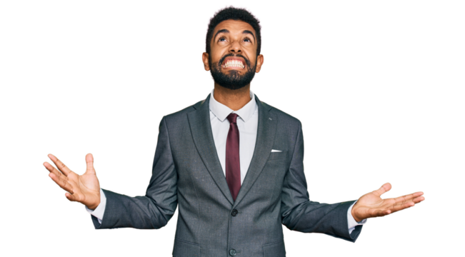 Young african american man wearing business clothes crazy and mad shouting and yelling with aggressive expression and arms raised. frustration concept.