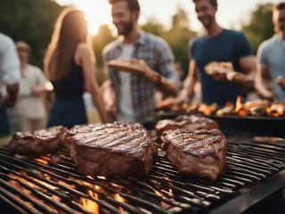  close-up of fried steaks on the barbecue, blurred image of people having fun together in the background  © abu