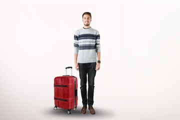 Young guy walking with big suitcase