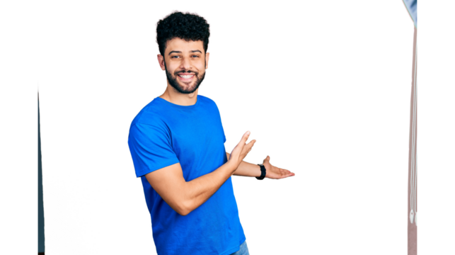 Young arab man with beard wearing casual blue t shirt inviting to enter smiling natural with open hand
