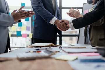 Business success. Business people handshake agreement confirmed in the investment business.