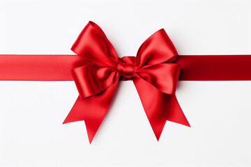 Fototapeta premium Gros plan sur un ruban de soie rouge sur fond blanc. Noeud, cadeau, Noël. Pour conception et création graphique.