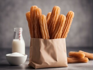 Fototapeta na wymiar Traditional churros sticks in paper bag with sugar