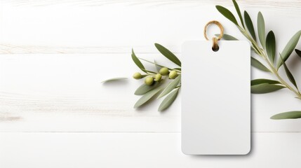 white blank tag with blank front realistic on a mockup template in a white wooden table with olive leaf branch