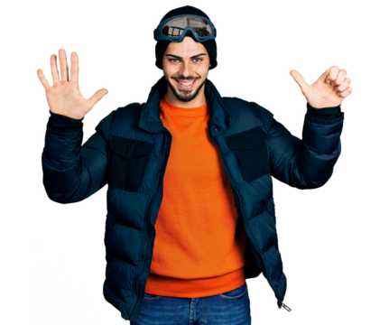 Young hispanic man with beard wearing snow wear and sky glasses showing and pointing up with fingers number six while smiling confident and happy.