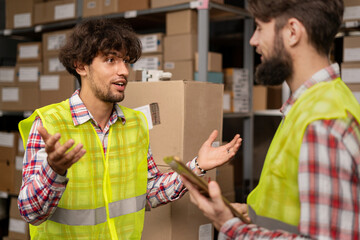 Warehouse Logistic concept. Warehouse diversity workers talking together and checking stock goods...