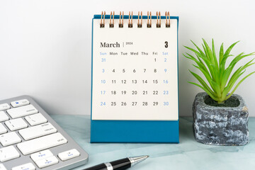 March 2024 Desk Calendar on top of table - obrazy, fototapety, plakaty