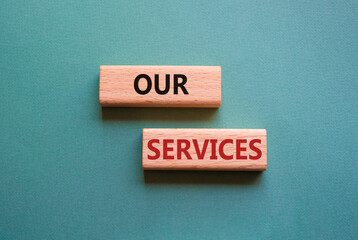 Our services symbol. Concept words Our services on wooden blocks. Beautiful grey green background. Business and Our services concept. Copy space.