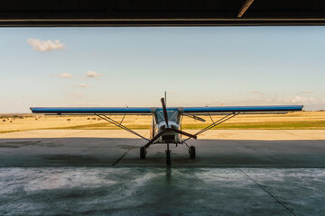 Aircraft at Rest in Hangar against clear sky