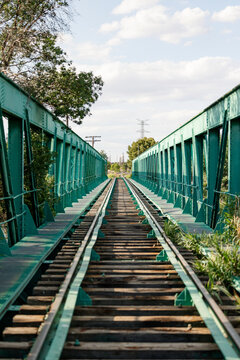 Vanishing Point Perspective on a Green Railway Bridge