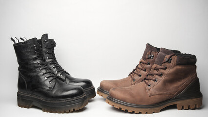 Men's and women's leather winter boots on a white background