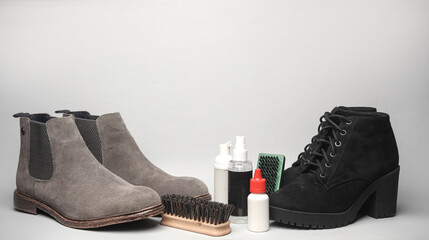 Men's and women's suede boots with accessories for shoe care on a white background