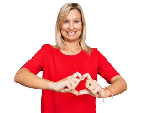 Middle age caucasian woman wearing casual clothes smiling in love doing heart symbol shape with hands. romantic concept.