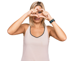 Middle age caucasian woman wearing casual clothes doing heart shape with hand and fingers smiling looking through sign