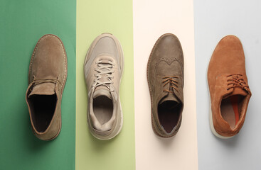 Different men's shoes on a colored background. Top view. Creative fashion layout