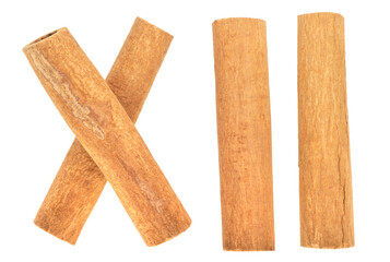Cinnamon sticks, Roman numeral twelve concept, isolated on white background.