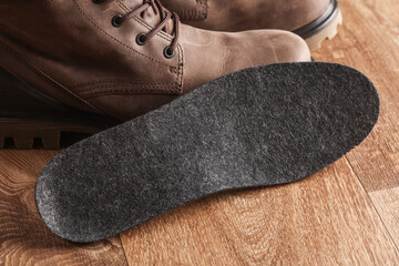 Felt insole of winter boots on the floor