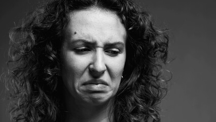 Female Expressing Extreme Aversion, Disgusted Reaction Portrait in black and white, monochromatic...