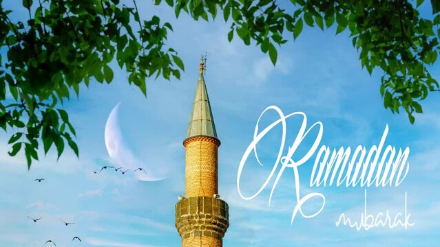 Ramadan Kareem or Ramazan mubarak . Georgian Gate Mosque and crescent moon blue sky . Ramadan Kareem text in the image. High quality 4k footage