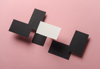 Composition of floating business cards on pink background. Business concept