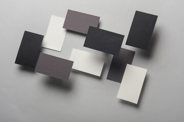 Composition of floating business cards on gray background. Business concept